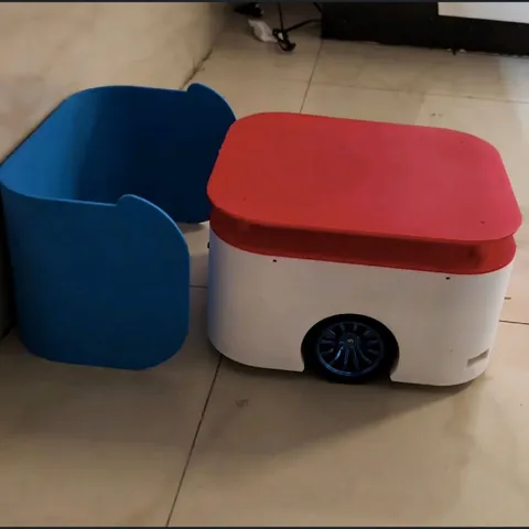 MechaBot, a 3D-printed differential-drive robot, next to its charging dock