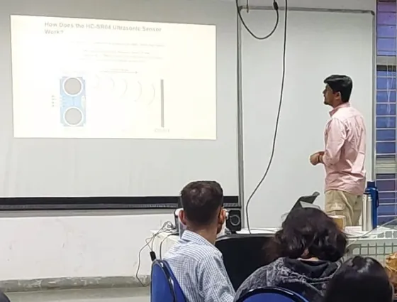 Kumar teaching a classroom of students about the HC-SR04 ultrasonic sensor